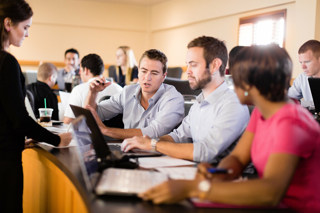 crummer mba students on laptops