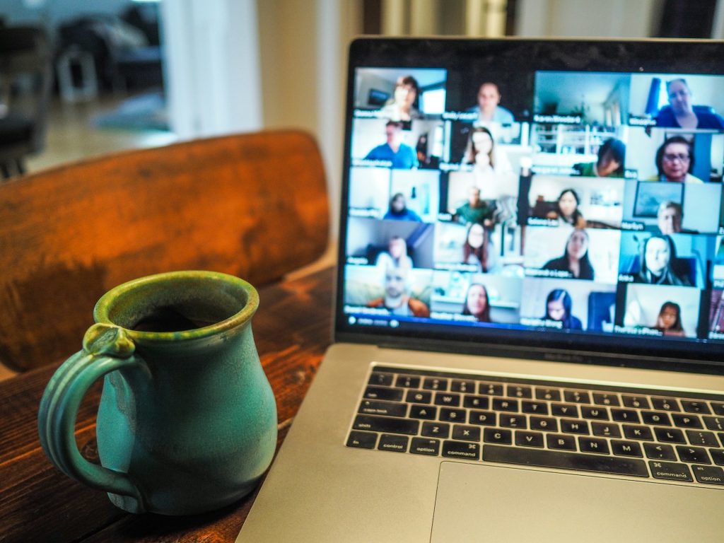 remote zoom meeting on laptop with coffee