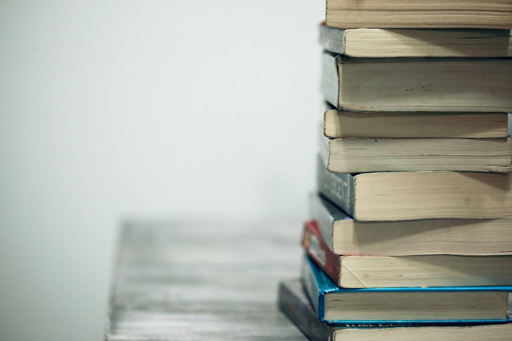 stack of books on a table 