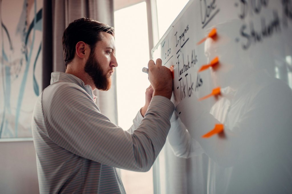 mba marketing specialization man brainstorming on whiteboard