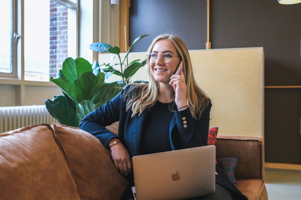 woman accepting job offer over the phone 